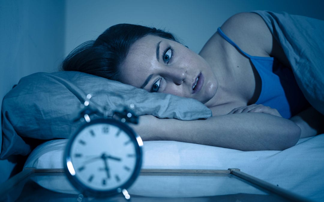 woman-wide-awake-looking-at-alarm-clock