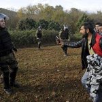 Пукање кај граничниот премин „Богородица“, приведени 15 мигранти Macedonian police officers block stranded migrants as they attempt to cross the Greek-Macedonian border, near Gevgelija
